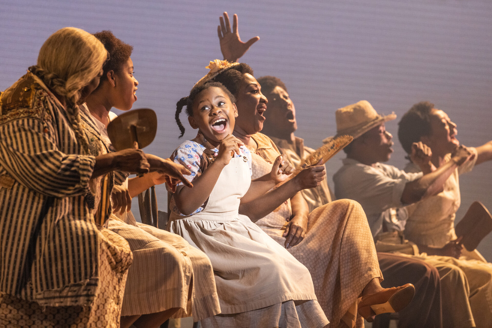 Brianna Cameron as 'Young Anna Mae' and the North American touring company of TINA - The Tina Turner Musical. photo by Matthew Murphy for MurphyMade, 2023